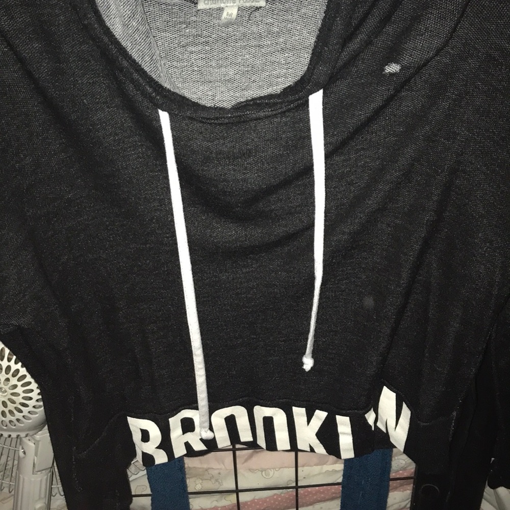 Black crop sweater, tiny hole on the shoulder